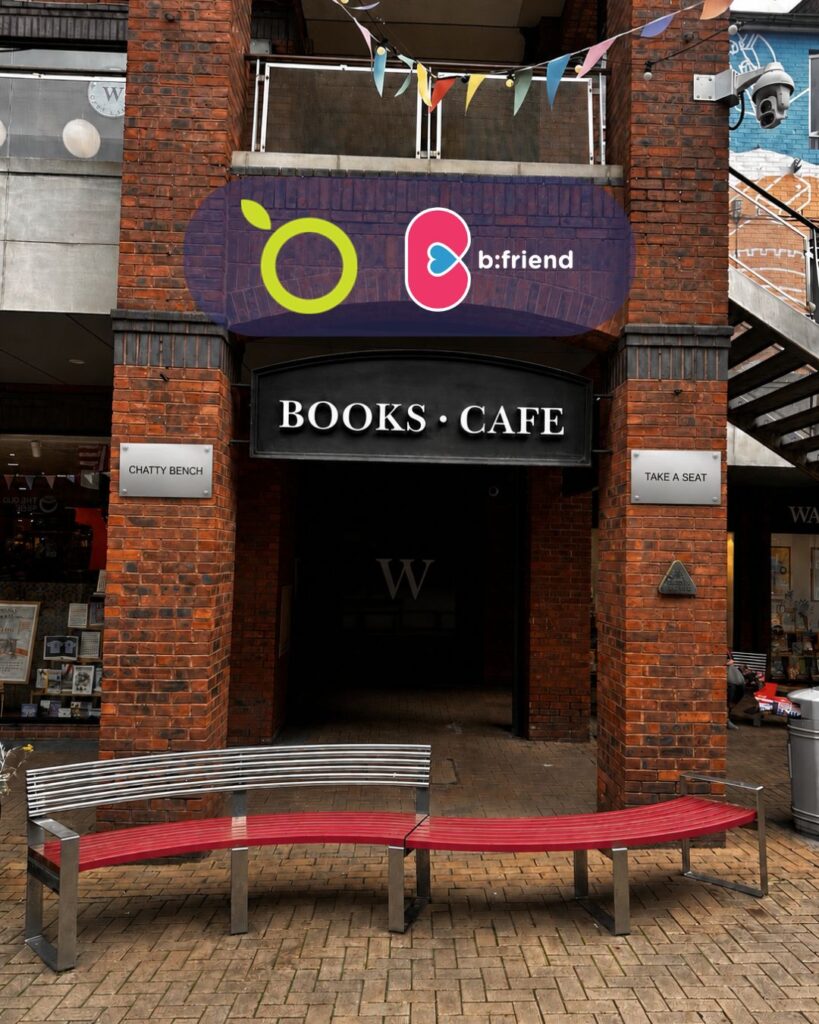 Image of a pink and grey bench in front of a book shop and cafe. Features the Orchard Square and b:friend logo